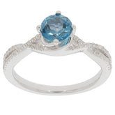 Round Blue London Topaz Sterling Silver Ring with accent diamonds, perfect for elegant occasions.